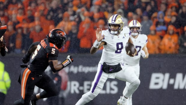 Nov 18, 2023; Corvallis, Oregon, USA; Washington Huskies quarterback Michael Penix Jr. (9) runs the ball against Oregon State Beavers linebacker Easton Mascarenas-Arnold (5) during the first half at Reser Stadium.